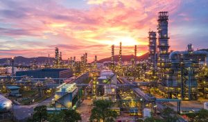 Aerial view Oil refinery.Industrial view at oil refinery plant form industry zone with sunrise and cloudy sky.Oil refinery and Petrochemical plant at dusk Thailand. Oil refinery background.