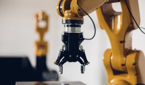 New Generation Robotic Arm Ready for Work on a Production Line. New robot arm for the production line of industrial factory. Robot arm manipulator at the factory. Industrial automation technology.