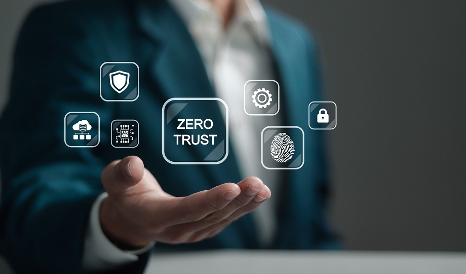 Zero trust security concept. Business information security network. Businessman holding zero trust icon on virtual screen.