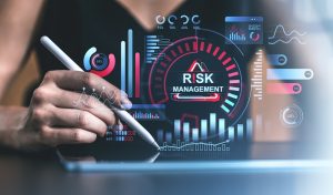 Risk management analysis with digital interface overlaid on a tablet in a professional setting.