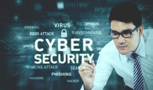 Picture of young businessman wearing glasses while writing a text of cyber security on the virtual screen