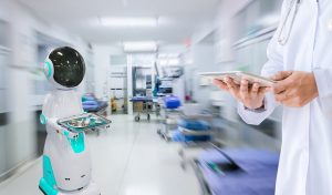 Automated hospital robot delivering supplies while a doctor reviews data on a tablet