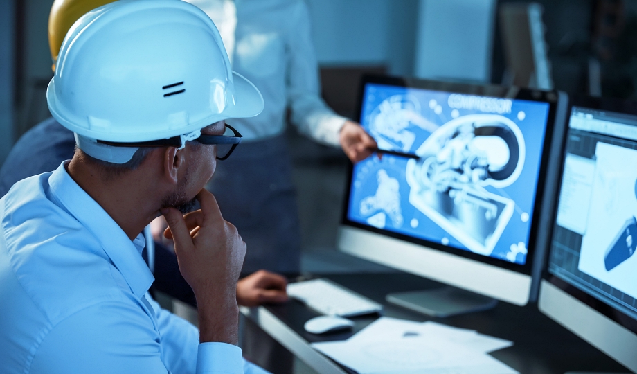 Drafter reviewing CAD models on monitors for a piping designer career